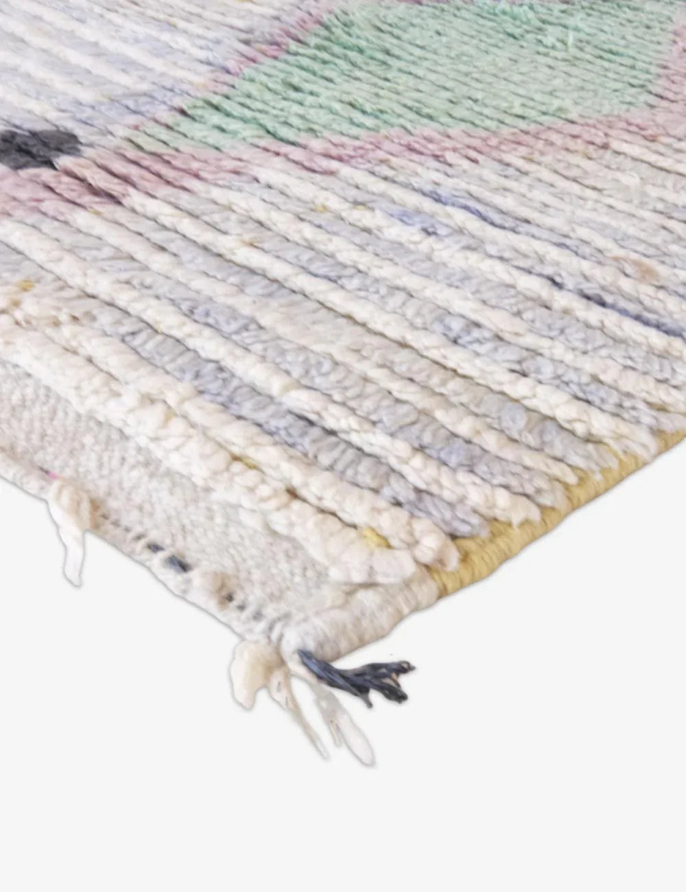 Multicolored woven rug with fringe on a white background