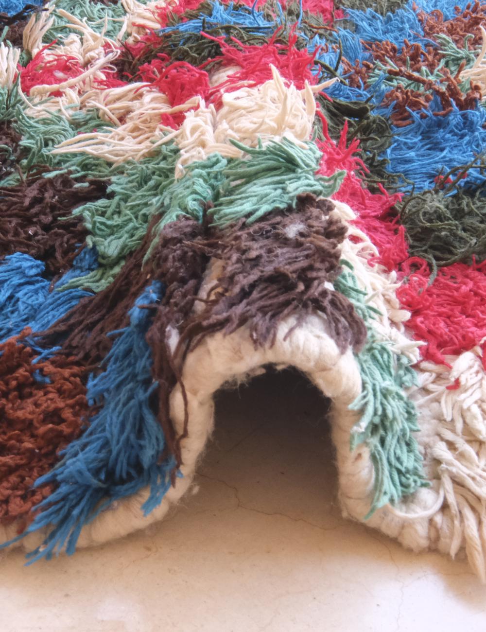 Colorful textured surface with a small animal hideout