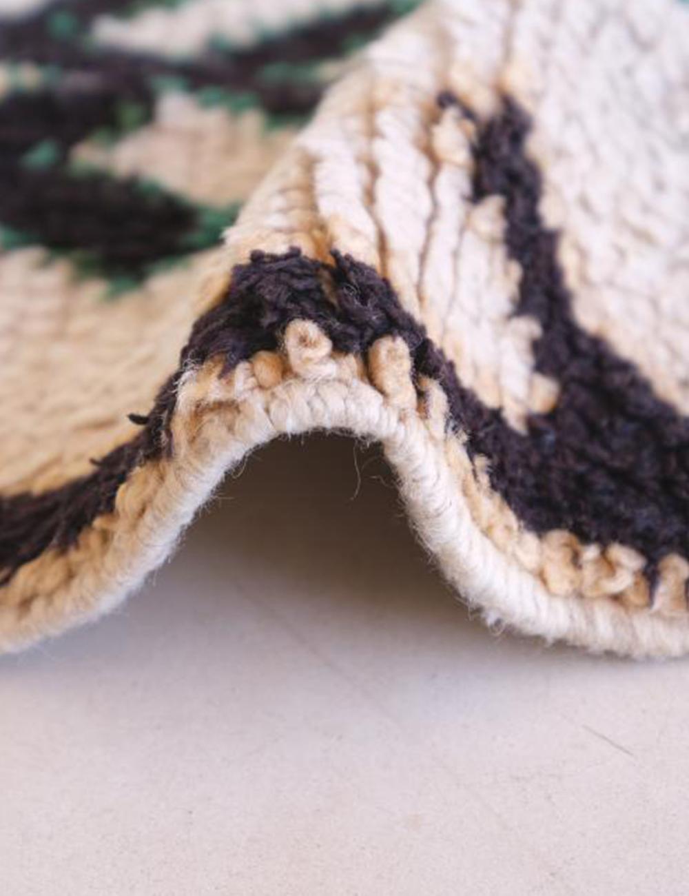 Close-up of a textured fabric with a pattern on a light background