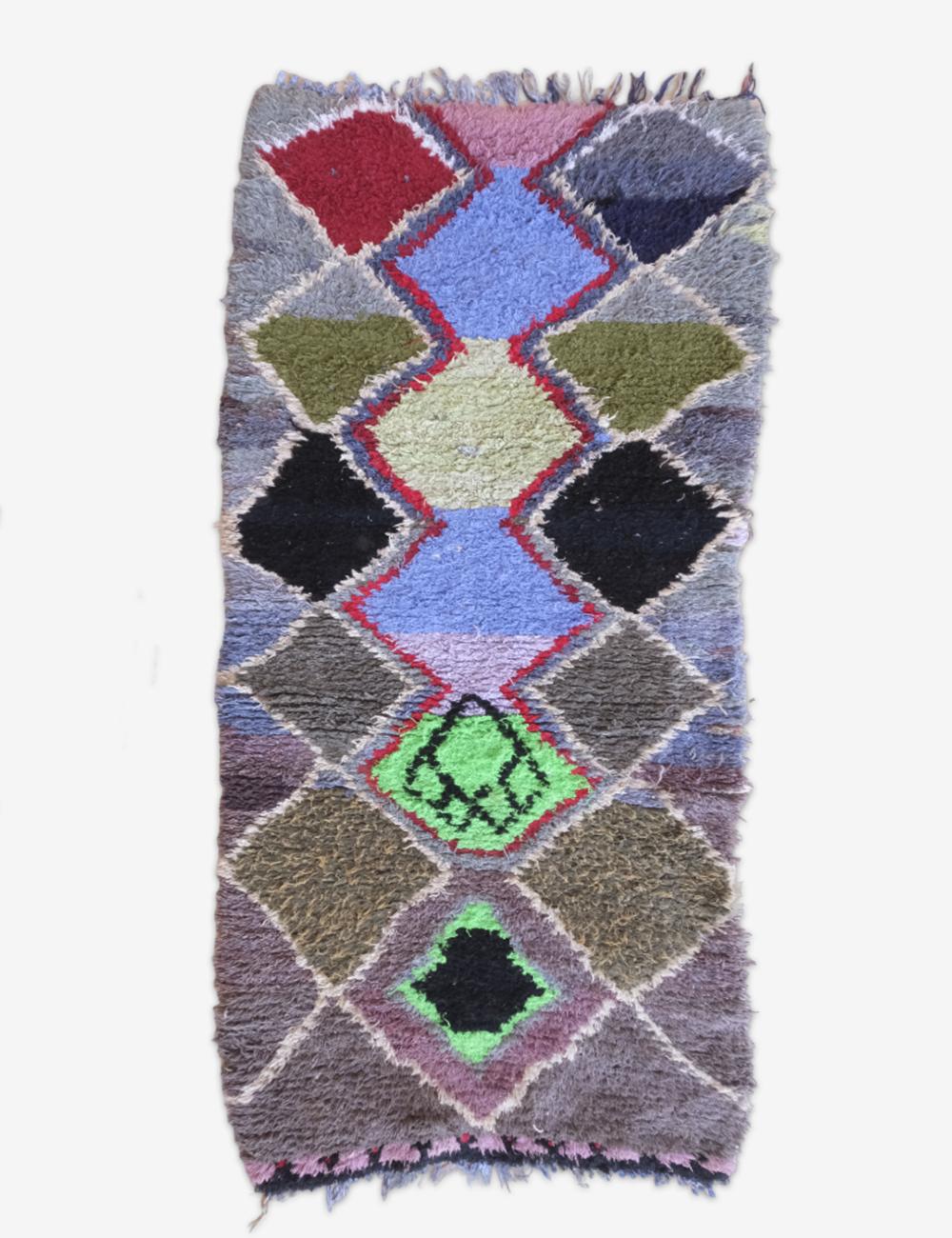 Patchwork rug with geometric pattern on a white background