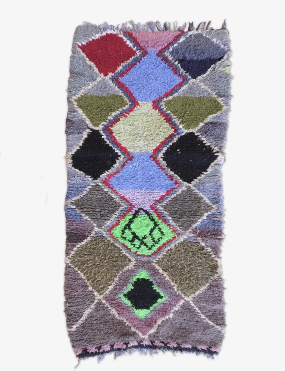Patchwork rug with geometric pattern on a white background