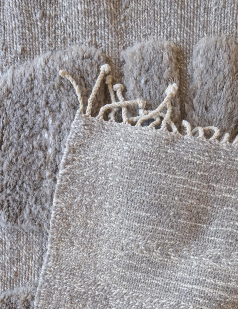 Close-up of textured fabric with frayed edge