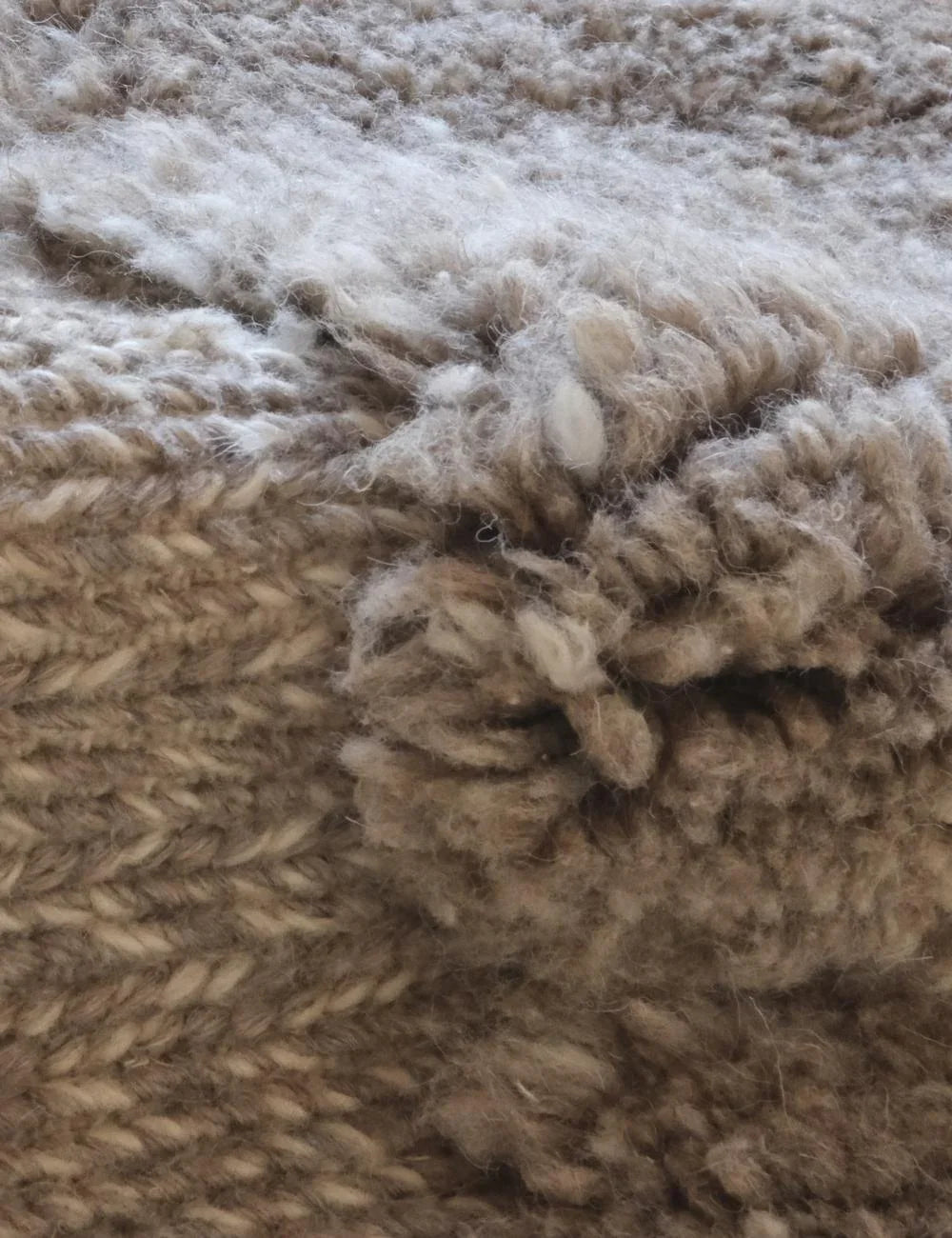 Close-up of a textured beige fabric surface