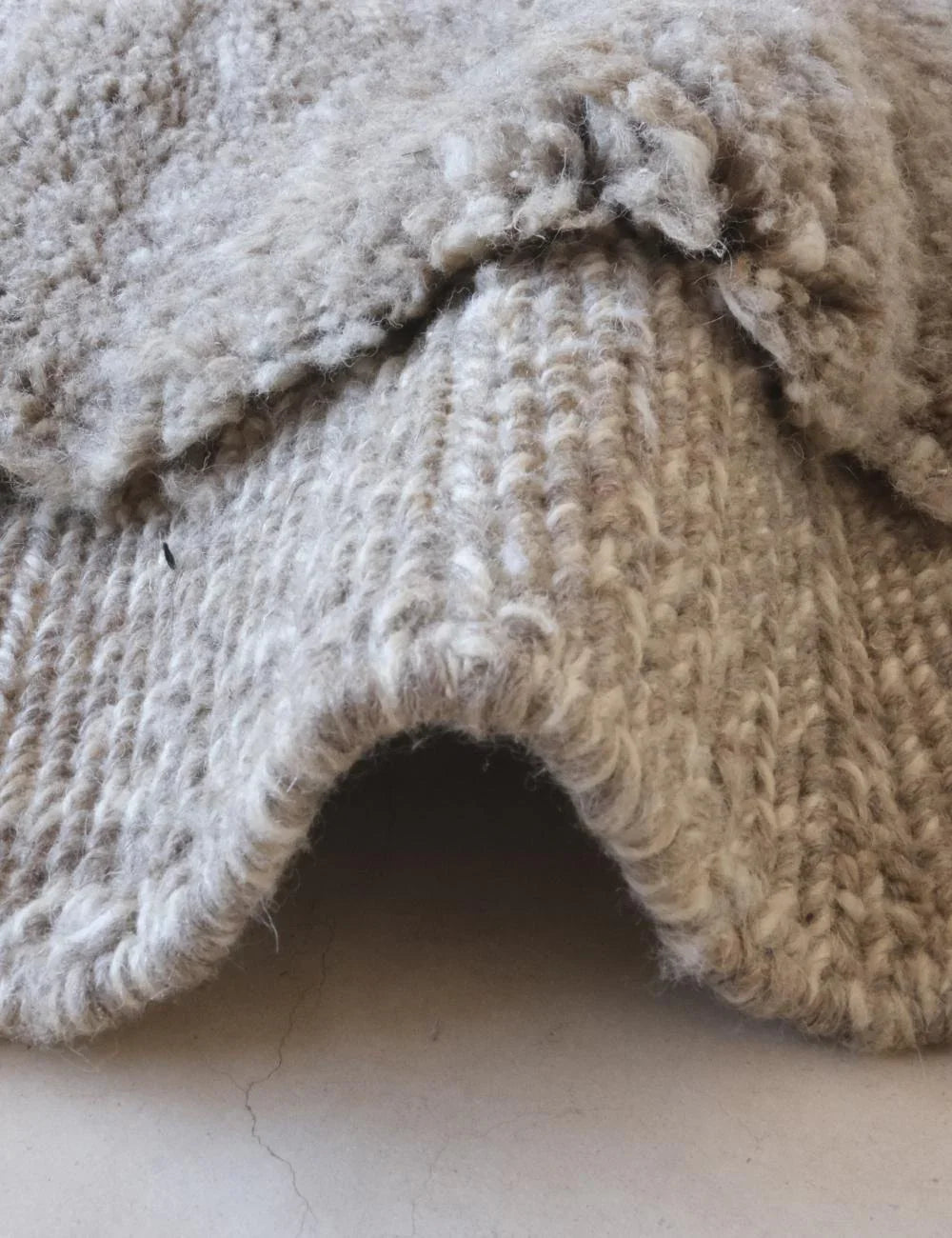 Close-up of a textured beige fabric surface