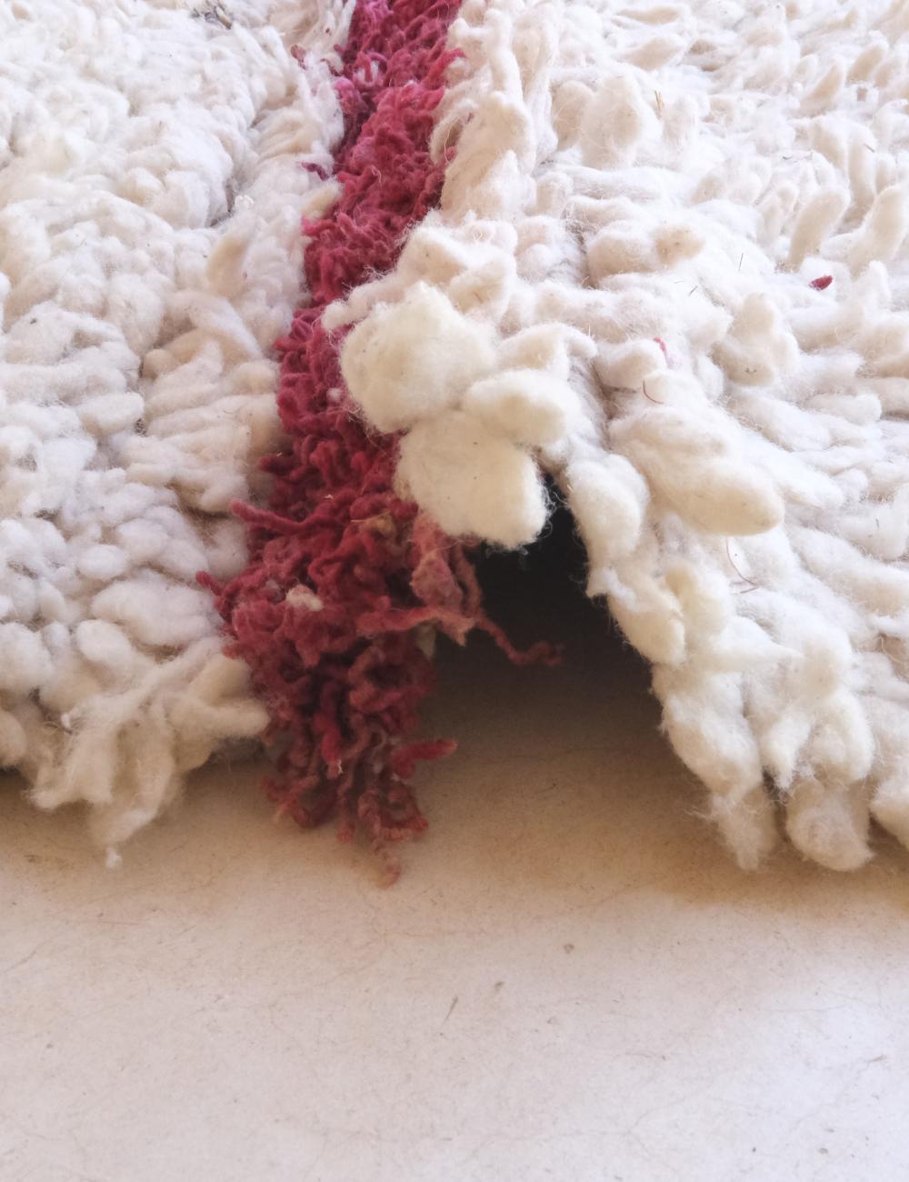 Close-up of a textured white and red fabric surface