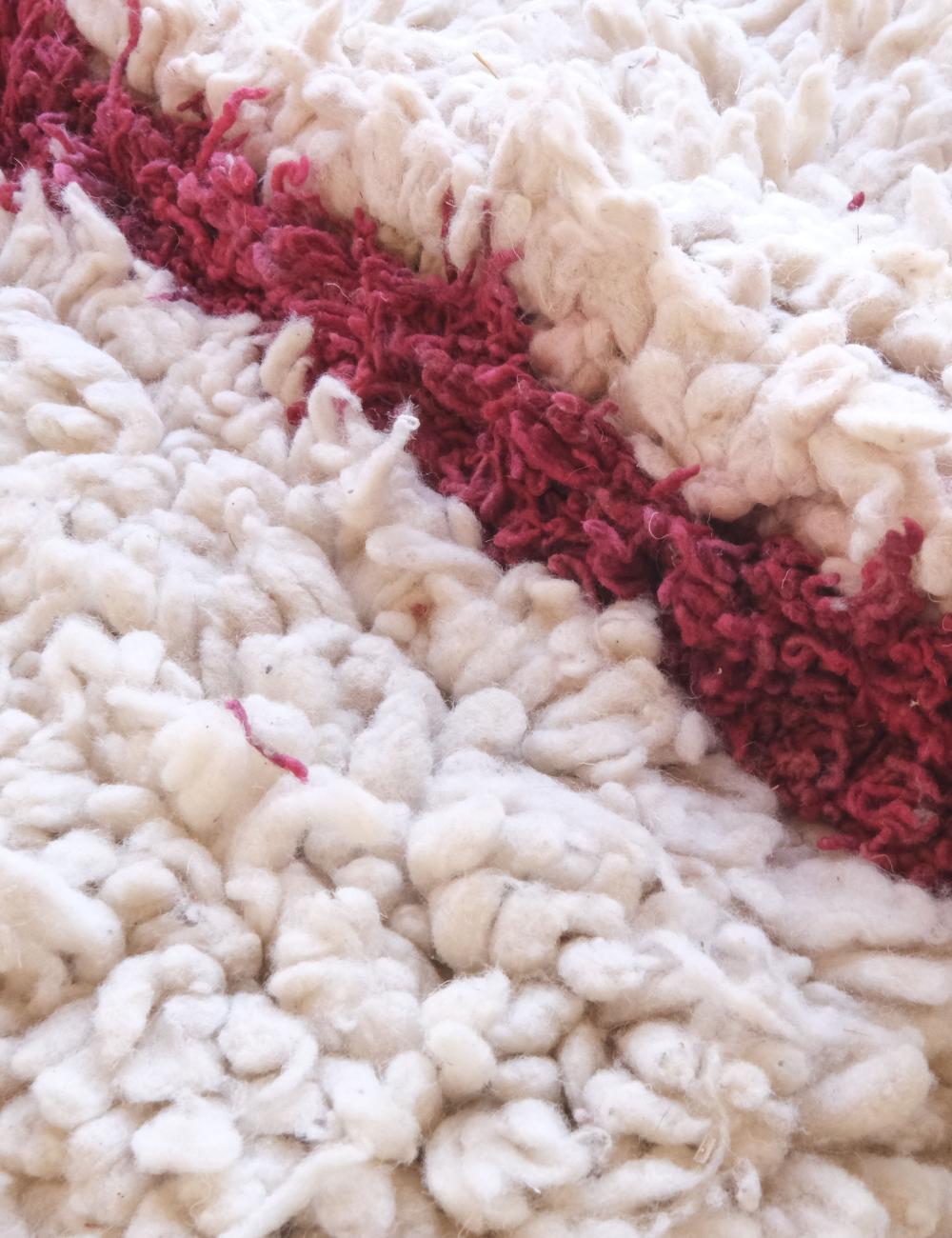 Close-up of a textured white and red fabric surface