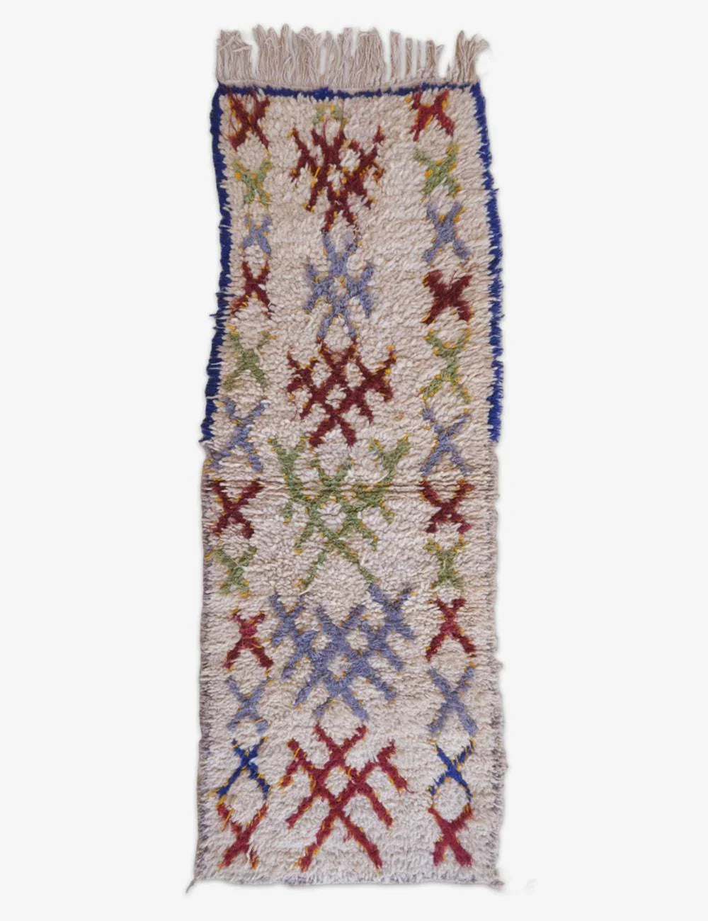 Colorful woven rug with geometric pattern on a white background