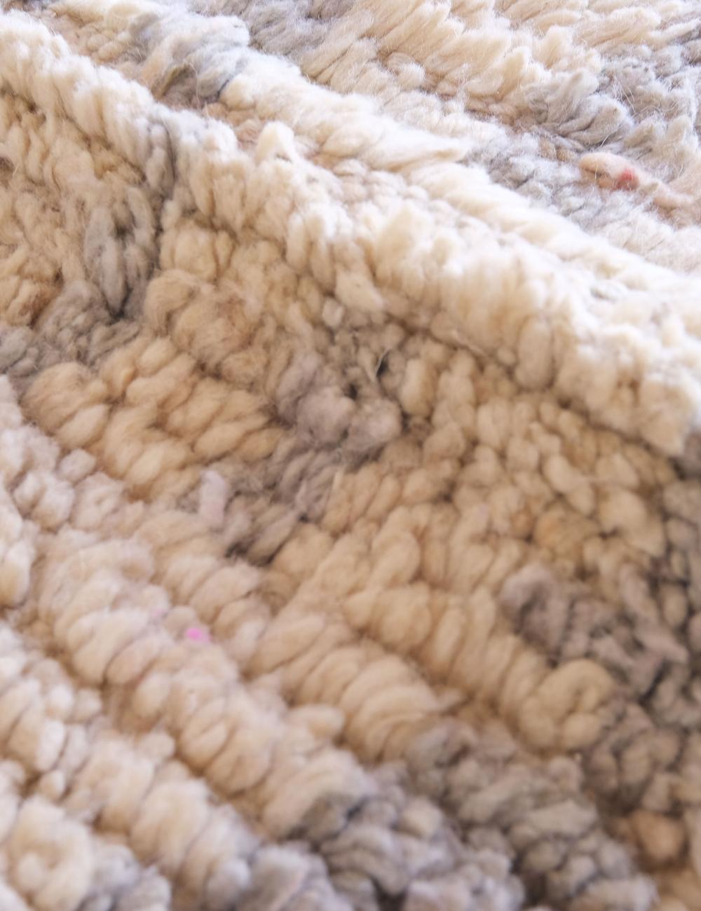 Close-up of textured beige carpet