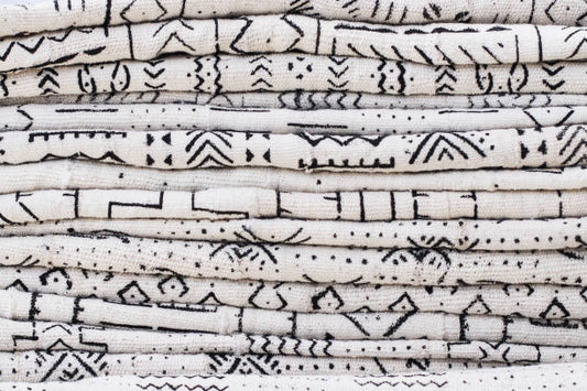 The Story Behind Bògòlanfini: How Mudcloth is Dyed with River Mud and Herbs