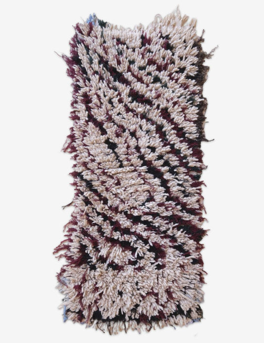 Textured rug with wavy pattern on a white background