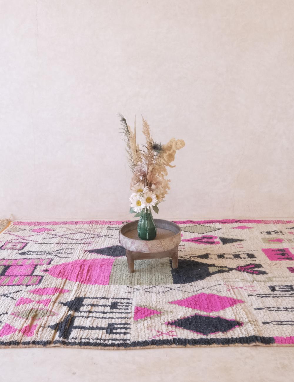 Decorative rug with geometric pattern on a light background