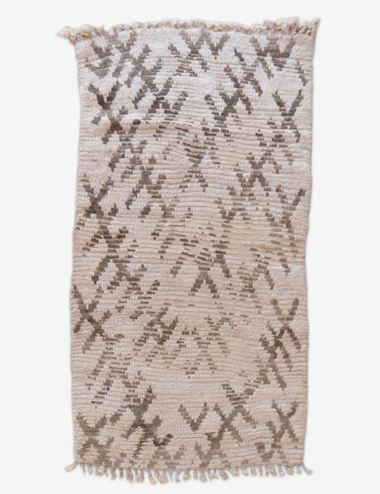 Textured area rug with geometric pattern on a white background