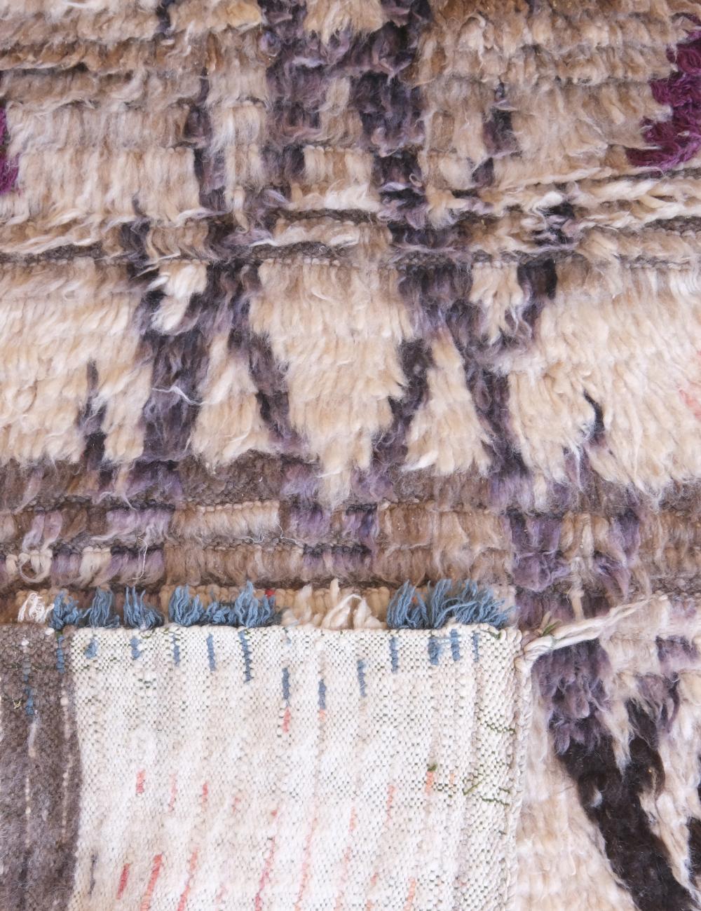 Close-up of a textured fabric with a patterned edge