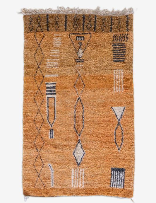 Patterned rug with geometric design on a white background